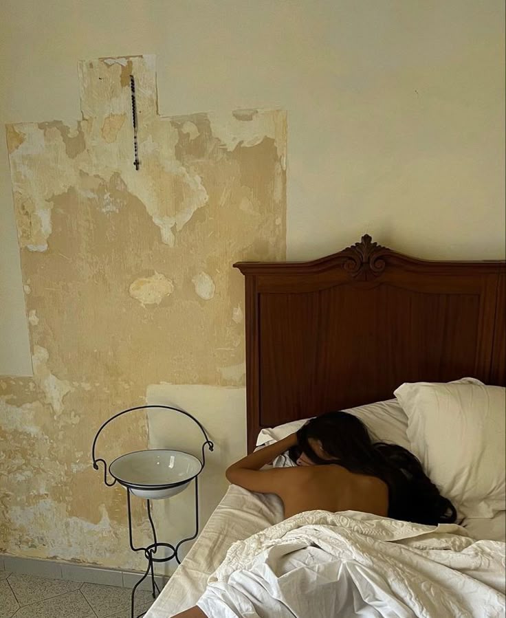 Quiet vintage bedroom with soft white bedding